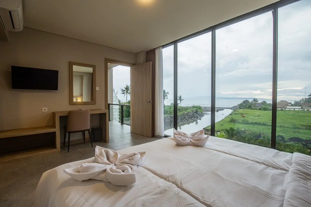 Sea View Room with Balcony panorama overlooking ocean at Divinepath Bali
