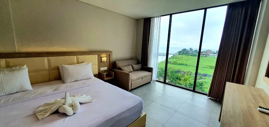 Sea view room with sofa and ocean window for 300 hour yoga teacher training Bali