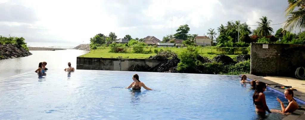 Infinity pool overlooking ocean landscape at Bali 300 hour yoga teacher training campus