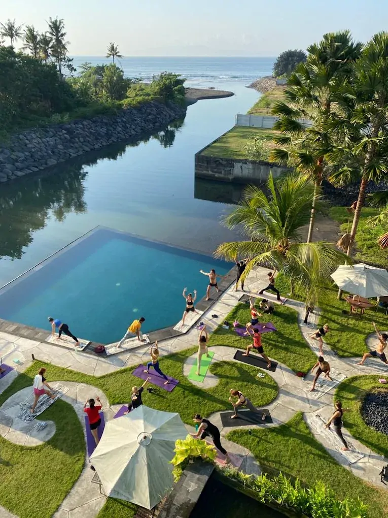 Outdoor yoga class with ocean view at Divinepath Bali 300 hour campus