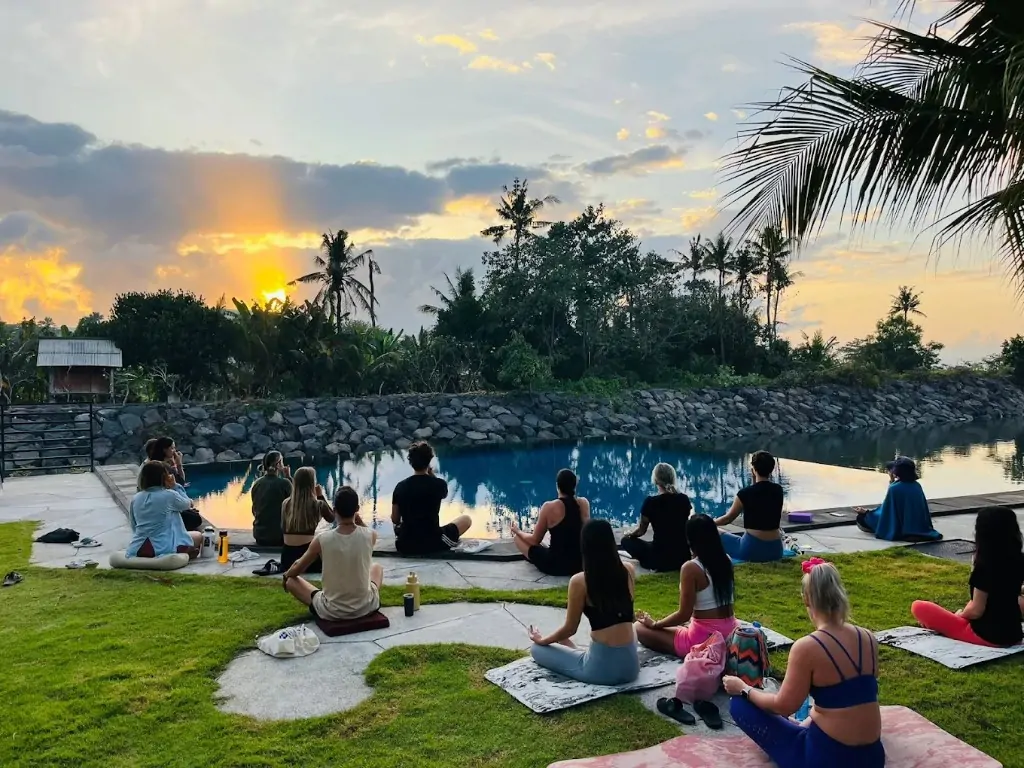 Sunset yoga by the pool at Divinepath Bali 300 hour campus