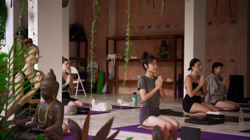 Students practicing meditation in the yoga shala at DivinePath Ubud campus on Jl. Bisma