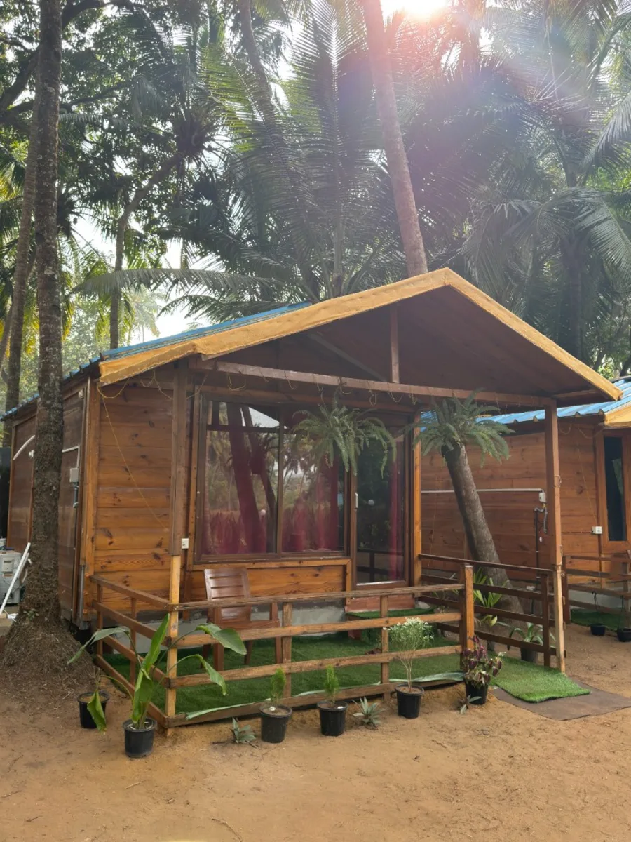 Wooden cottage exterior for 300 hour yoga teacher training accommodation in Goa