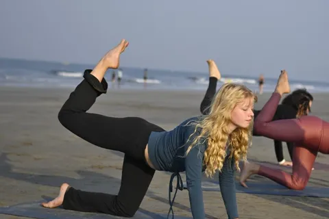 Beach yoga class during Ashtanga YTT in Goa