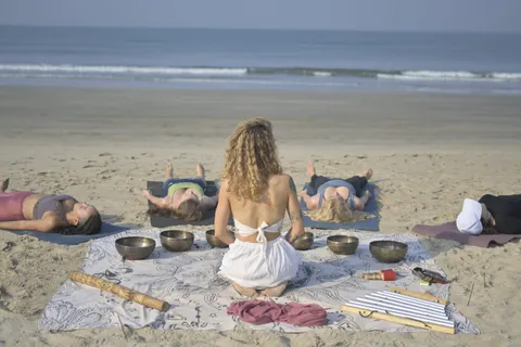 Sound healing session on the beach during Goa yoga teacher training