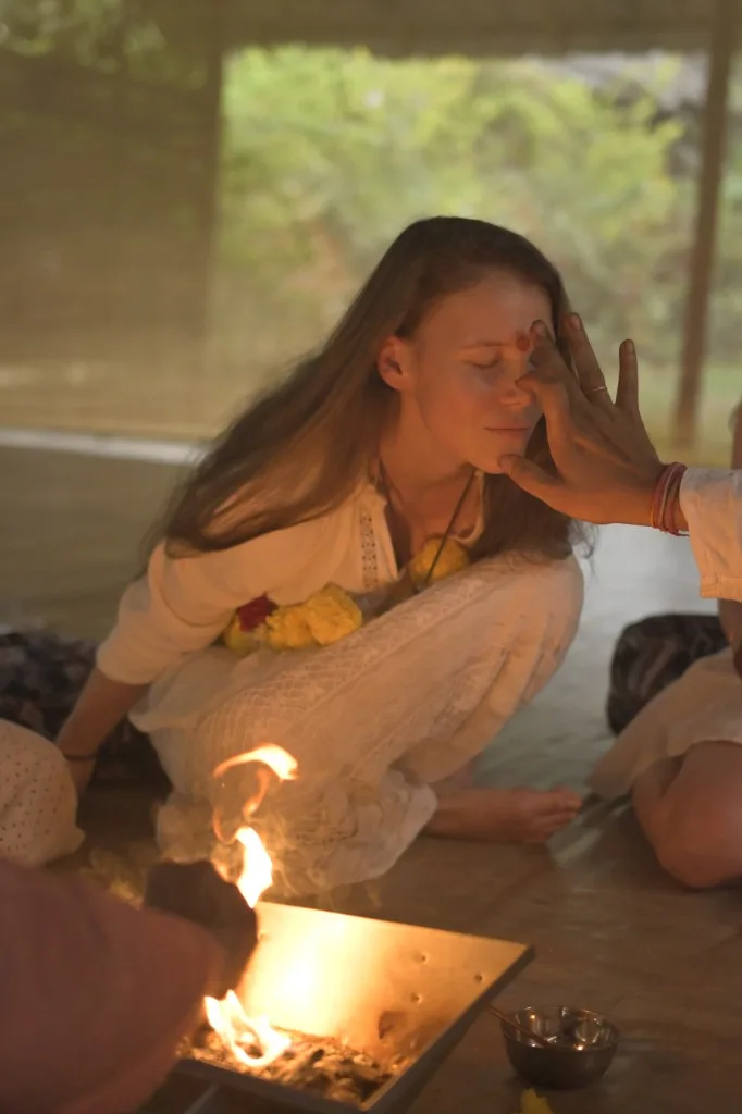 Tilak blessing during fire ceremony at Divinepath Goa