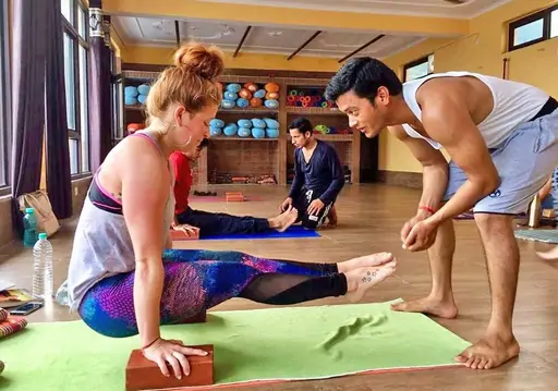 DivinePath yoga teacher training campus in Arambol, Goa — students practising in the shala