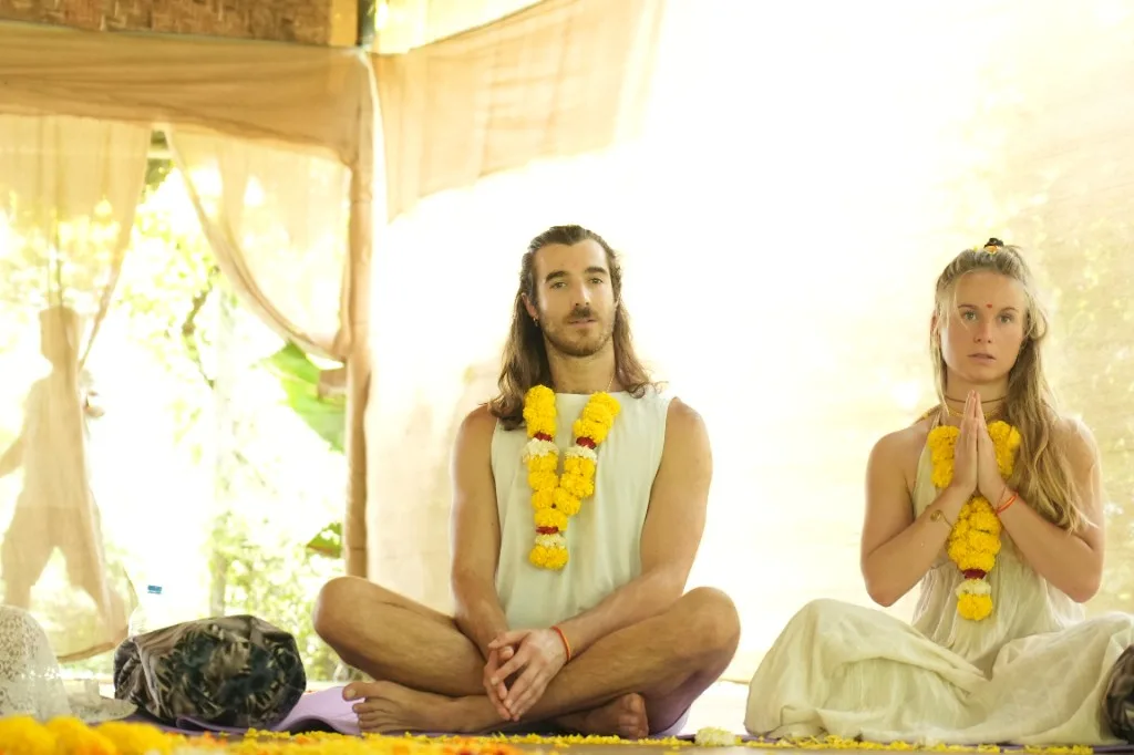 Two students in marigold garlands during the opening ceremony at Divinepath Goa