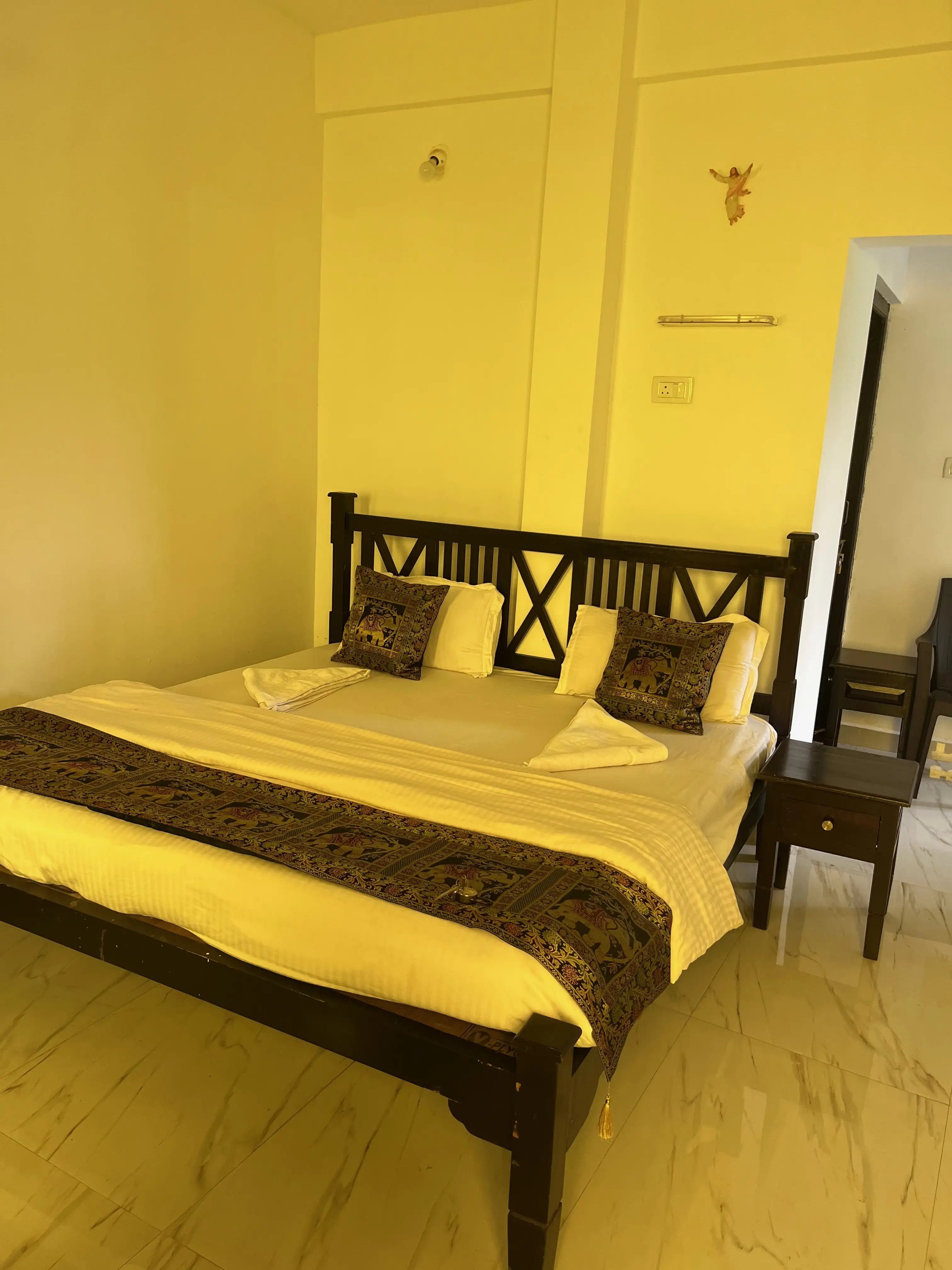 Ensuite private room interior on campus — budget stay during 200 hour YTT Goa