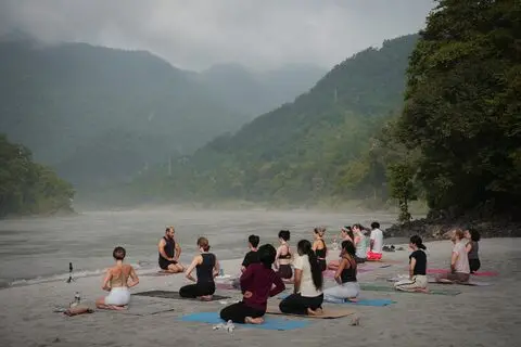 Seated circle on the Ganga beach