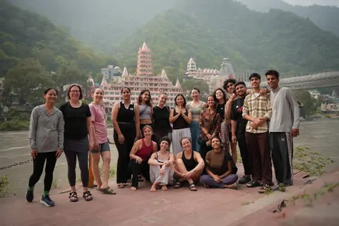 500 hour yoga teacher training group on the Ganga ghat in Rishikesh
