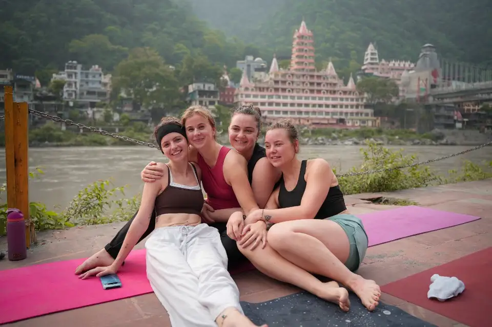 Yoga students on the Ganga ghat near Laxman Jhula during 200 hour yoga teacher training in Rishikesh