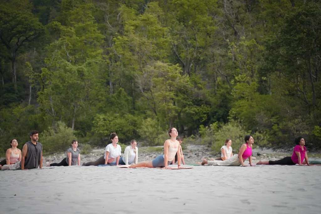 Warrior II pose in yoga class Rishikesh