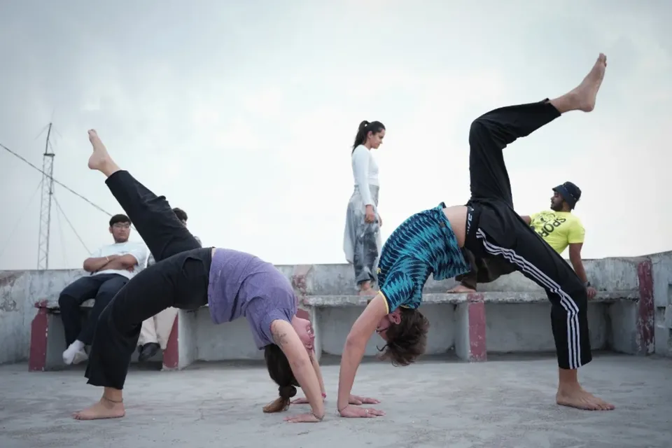 Students bonding on the rooftop during the hardest week of Rishikesh yoga teacher training